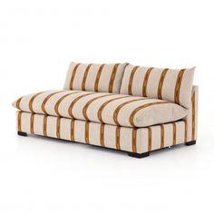 a striped couch sitting on top of a white floor