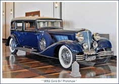 an antique car on display in a museum