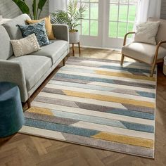 a living room filled with furniture and a rug