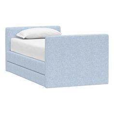 a bed with a blue headboard and white pillows on top of it, in front of a white background