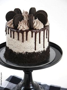 a cake with oreo cookies and cream on top