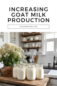 three jars filled with milk sitting on top of a wooden cutting board in front of a sink