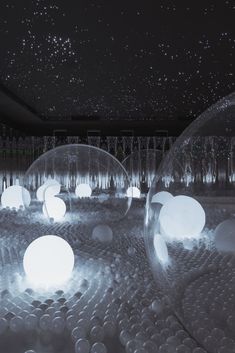 an image of some balls in the air with lights on them and stars above it