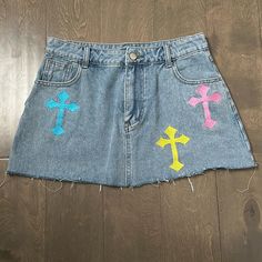 Denim Mini Skirt With Embroidered Crosses. Frayed Bottom. Nwot. Denim Skirt Design Ideas, Costumized Clothes, Custom Denim Skirt, Skirt With Patches, Painting Skirt, Jeans Painting, Cross Skirt, Patch Skirt, Embroidered Denim Skirt