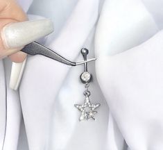 Super cute handmade y2k 2000s silver diamond rhinestone star flower dangling belly piercing ring bar.  Can't find anywhere else!  Surgical steel  FREE STANDARD UK SHIPPING Silver Star Belly Rings, Silver Dangle Belly Rings Nickel Free, Nickel-free Silver Dangle Belly Rings, Y2k Silver Star Jewelry, Y2k Style Silver Star Jewelry, Silver Dangle Body Jewelry With Internally Threaded Design, Adjustable Silver Star Belly Ring, Nickel-free Silver Dangle Body Jewelry, Dainty Adjustable Silver Belly Rings