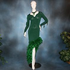 Latin-Rhythm Dress-Jade will fit size 5/6-11/12, very stretchy    This luxurious Latin-rhythm dress exudes glamour with emerald chandelle feathers, glimmering slinky fabric, and opulent hand beading. Its long-sleeved design has several peek-a-boos, ensuring you turn heads on the dance floor. Plus, a matching choker with dazzling gold aurum Swarovski rhinestones and hand beading finishes the look. Feel confident and stylish in this stunning dress - ready for a sizzling tango, rumba bolero or any other Latin-rhythm occasion! Customization can be added to most any dress! Variations can be custom made especially for you! Dependent on other orders, allow 6-10 weeks for custom orders. For any questions or help call 440-327-7121 More rhinestone work and/or hand beading can be added for an extra f Rhythm Dress, Rumba Dresses, Social Dance, Tango Dress, Dance Pants, Ballroom Dance Dresses, Latin Dress, On The Dance Floor, Dance Skirt