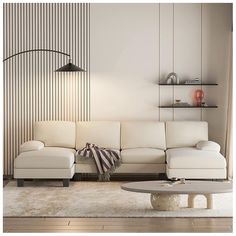 a living room with a white couch and coffee table in front of a striped wall