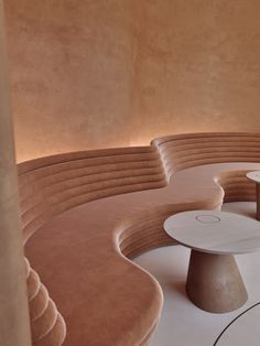 the circular seating area is made up of different shapes and sizes, including round tables