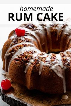 a bundt cake with icing and cherries on top