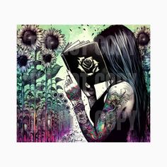 a woman with tattoos holding a book in front of some sunflowers and flowers