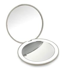 an empty compact mirror on a white background