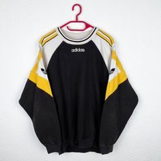 🚨 follow us on instagram @bestclassicvintage 🚨 Beautiful vintage Adidas sweater from the 90s. Very good vintage condition. Size approximately M-L Pit to pit: 60cm Back length: 74 cm 1990 Nike Sweater, Black Vintage Sweater For Streetwear, Vintage Black Sweatshirt With Ribbed Cuffs, Vintage Long Sleeve Sweater For Streetwear, Vintage Sweater For Fall Streetwear, Vintage Fall Sweater For Streetwear, Vintage Yellow Long Sleeve Sweatshirt, Yellow Vintage Long Sleeve Sweatshirt, Vintage Sweater With Ribbed Cuffs