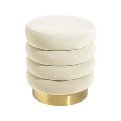 four white round stools stacked on top of each other in front of a white background