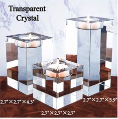 two clear candles are sitting in front of each other on a table with the words transparent crystal