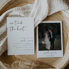 an image of a couple on their wedding day with the save the date card in front