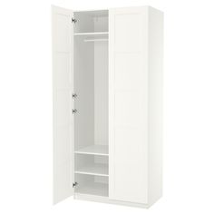 an open white closet with shelves and doors