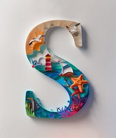 the letter s is made up of colorful paper