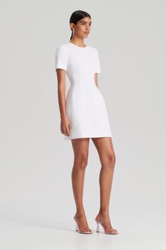 The Stretch Reptile Mini Dress infuses modern silhouettes with timeless styling. Crafted from a textured, high-stretch fabrication, the mini dress is tailored to accentuate the waist. Pair with luminous accessories and sleek footwear for an elegant ensemble. White Mini Dress, Fit Inspo, Reptiles, Sleek, Mini Dress, Fabric, White, Clothes