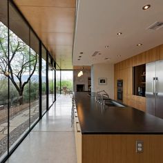 the kitchen is very large and has glass walls