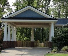 a white and blue gazebo sitting in the middle of a park