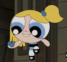 the powerpuff girls cartoon character with blue eyes and blonde hair is flying through the air