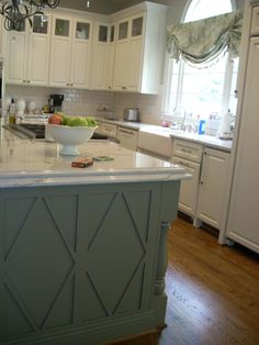 a large kitchen island with a bowl on it