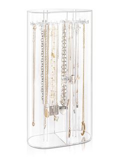 a clear display case with lots of necklaces and bracelets hanging from it's sides