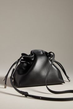 Leather; faux-suede lining Includes detachable black rhinestone braided strap and leather strap Two inner slip pockets Magnetic closure Imported | Alli Bucket Bag & Rhinestone Strap by ROCKNOT in Black, Women's, Leather/Suede at Anthropologie Braided Strap, Black Rhinestone, Black Fits, Magnetic Closure, Wedding Accessories, Faux Suede, Bucket Bag, Leather Straps, Clothing And Shoes