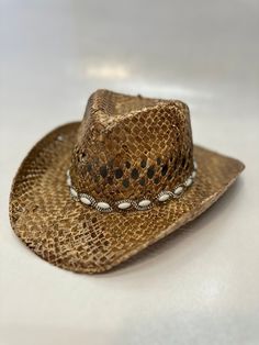 Add some western flair to your child's or your own wardrobe with our Cowgirl Hat! Made from high-quality woven straw, this hat is perfect for those who want to embrace the stylish and trendy cowgirl look. Featuring a classic western style with a wide brim that provides ample shade and protection from the sun, our Cowgirl Hat comes in a pretty tan color with rhinestone detailing that adds a touch of glamour to your outfit. This hat is available in both child and adult sizes, making it perfect for all ages. Our Cowgirl Hat is perfect for any occasion, whether it's dress-up, rodeos, western-themed parties, or even everyday wear. With its stylish design and attention to detail, this hat will have you looking and feeling like a true cowgirl. Overall, our Cowgirl Hat is a must-have for anyone wh Look Cowgirl, Cowgirl Hats Western, Boho Chic Hats, Pretty Tan, Cowgirl Look, Cowgirl Accessories, Summer Hats Beach, Chapeau Cowboy, Cowgirl Hat