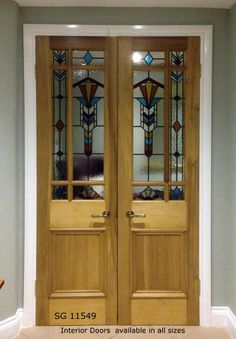 two wooden doors with stained glass panels in the middle and bottom, both side by side