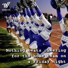 cheerleaders in blue and white uniforms holding pom - poms on their hands