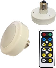 the remote control is next to an electronic light bulb and other electrical equipment on a white background