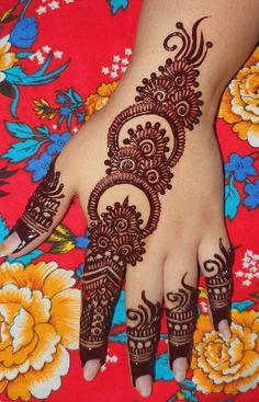 henna tattoo on the palm of a woman's hand