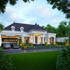 a large white house sitting on top of a lush green field