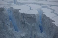 an aerial view of ice formations in the ocean