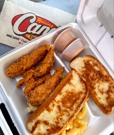 chicken sandwich and macaroni and cheese in a styrofoam container