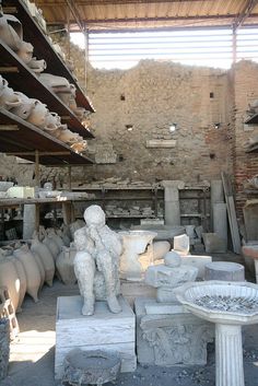 a room filled with lots of different types of vases