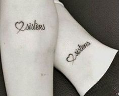 two people with tattoos on their legs and one has the word sisters written in cursive font