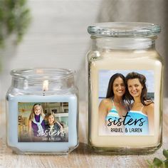 there is a candle next to a glass jar with a picture on the front and side