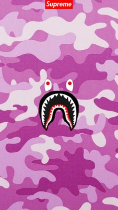 a pink camo wallpaper with a shark's mouth and red eyes on it