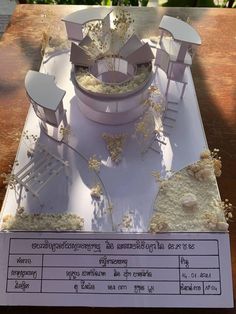 a cake made to look like a stage set with chairs and flowers on the table