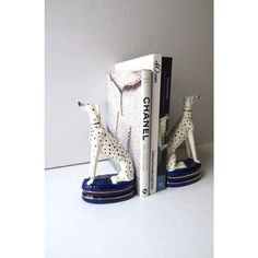 two bookends with dalmatian figurines next to each other