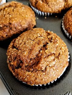 several muffins sitting on top of a baking pan