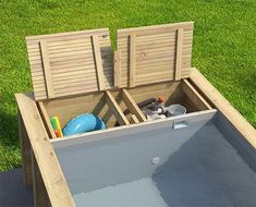 an empty pool with two wooden chairs in it