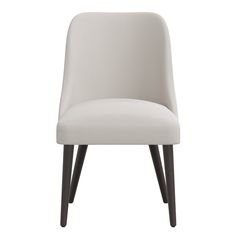 an upholstered white chair with black legs