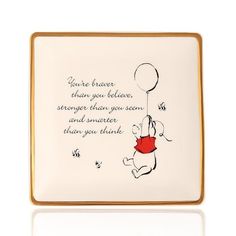 a winnie the pooh plate with a quote on it