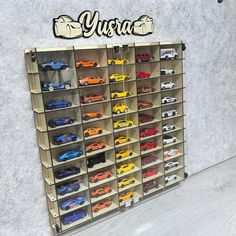 a display case filled with lots of toy cars