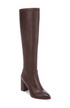 Classic and versatile, this boot is sure to be a fave thanks to a back zipper for easy on-and-off styling along with a pointed toe that gives you legs for days. 3 1/2" heel 15 1/4" shaft; 12 3/4" calf circumference Synthetic upper and lining/rubber sole Imported Fall Leather Tall Platform Boots, Fall Leather Platform Boots, Interview Boots, Medium Width High Shaft Boots For Work, High Shaft Calf Leather Boots For Work, Workwear High Shaft Boots With Stacked Heel, Sleek Brown Boots For Workwear, High Heel Boots With Zipper Closure For Work, Fall Knee-high Boots For Work With Zipper Closure