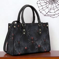 "Scary Black Tarantula Handbag, Dark Goth Witchy Purse, Dark Cottagecore Bag, Organized Goblincore Bag, Vegan Leather Dark Nature Handbag * PU Main material for ladies fashion handbag tote bag * Smooth zipper and all over printing customized style * Main compartment design with two top handles maintains balance * Two Side pockets and with the shoulder strap stitched and immovable * White & Black color for different style with wearing outfits * Great gifts for girls and mom ,also good use for off Gothic Black Bags With Large Capacity, Black Gothic Bag With Large Capacity, Gothic Large Capacity Black Bag, Gothic Large Capacity Shoulder Bag, Black Gothic Shoulder Bag, Gothic Bags With Adjustable Strap For Halloween, Gothic Halloween Shoulder Bag With Adjustable Strap, Black Halloween Shoulder Bag Satchel, Gothic Large Capacity Bag For Everyday Use