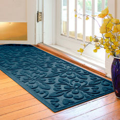 The Fleur Medallion Runner Mat decorates with a fun and flirty look. The antistatic PET polyester fiber floor accent has a fleur medallion design with a nonskid SBR rubber backing that is slip-resistant and certified by the National Floor Safety Institute.